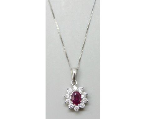 An 18ct gold ruby and diamond pendant, 0.4ct diamonds, with a 9ct white gold chain, 1.8cm pendant including bale, 2.2g total 