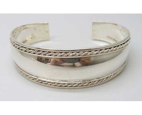 A silver torque bangle, 20g