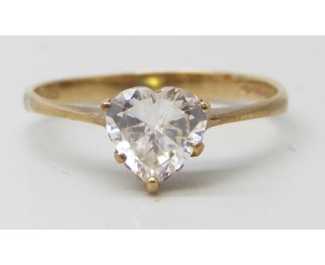 A 9ct gold ring set with a white heart shaped stone, 1.2g, K