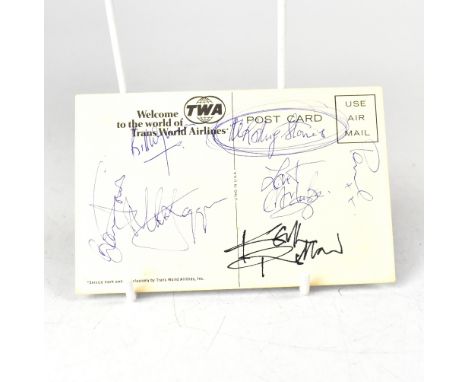 THE ROLLING STONES; a TWA postcard bearing the signatures of the rock legends.We have not authenticated these signatures, ple