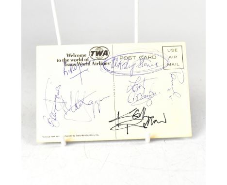 THE ROLLING STONES; a TWA postcard bearing the signatures of the rock legends.We have not authenticated these signatures, ple