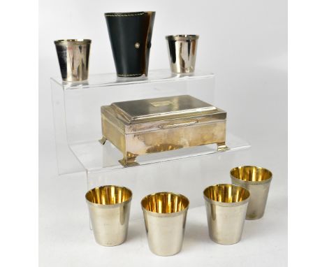 An Elizabeth II hallmarked silver cigarette box with engine turned decoration to the top, centred with a vacant cartouche, ra