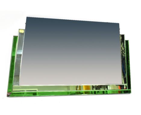 An Art Deco wall mirror with lozenge-shaped clear bevelled glass centre, with partial border of pale green and dark green bev
