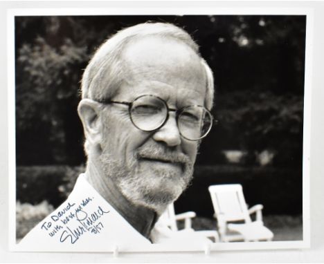 ELMORE LEONARD; a black and white promotional photograph bearing the author's signature and dated 3/97, 20.5 x 25cm.We have n