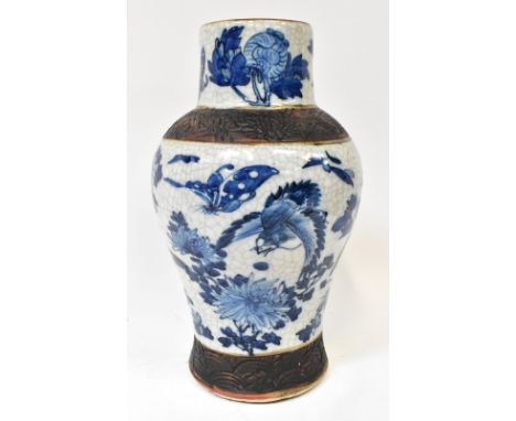 A 20th century Oriental vase, possibly Chinese, with hand painted blue body depicting butterflies, exotic birds, wild flowers