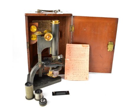 R &amp; J BECK, LONDON; a microscope with gunmetal mounts and brackets, marked 'Beck Ltd London, No.20272', two eye pieces, i