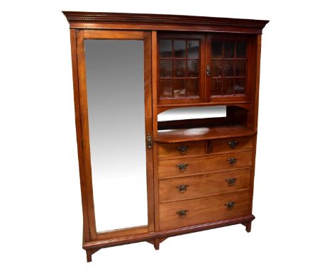 An early 20th century mahogany combination wardrobe dresser with a mirrored single wardrobe, next to a single glazed Arts and