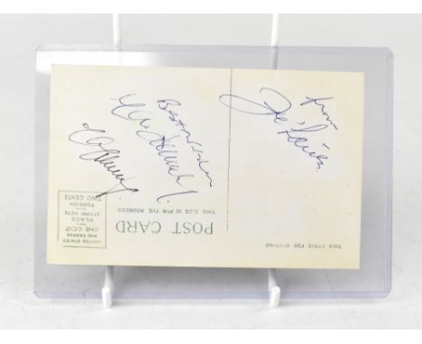 BOXING HISTORY; a photographic postcard bearing three signatures to the reverse including the boxing great Joe Louis. We have