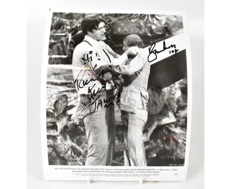 JAMES BOND; a reproduced black and white photograph from the film 'Moonraker', bearing the signatures of Richard Kiel and Rog