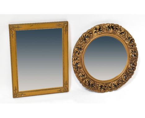 A rectangular bevel edged wall mirror in a gilt frame, with embossed floral decoration to the corners, 35.5 x 46cm, together 