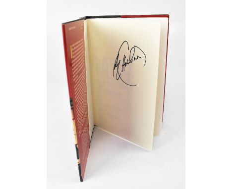 LARRY HOLMES; 'Against the Odds', a biography bearing the boxing star's signature.We have not authenticated this signature, p