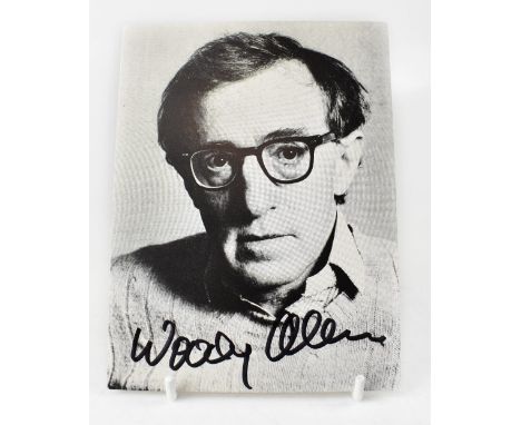 WOODY ALLEN; a black and white photographic postcard bearing the star's signature.We have not authenticated this signature, p