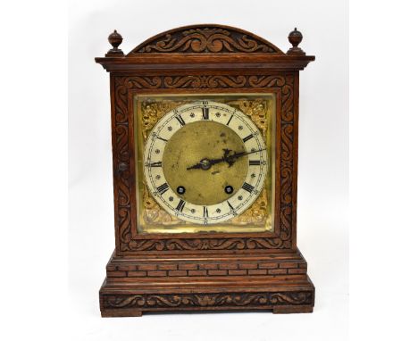 An early 20th century eight day mantel clock, the dial set with Roman numerals, 24 x 33cm.