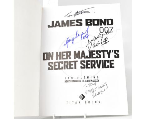 JAMES BOND; 'On Her Majesty's Secret Service', a comic book style book bearing several signatures including George Lazenby, D