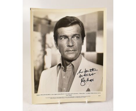 ROGER MOORE; a reproduced black and white photograph for the film 'Moonraker', bearing the star's signature, 25.5 x 20.5cm.We