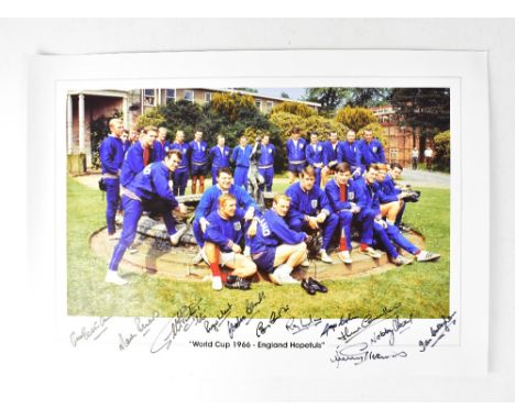 ENGLAND WORLD CUP WINNERS 1966; a reproduced coloured photograph of the squad, bearing numerous signatures to the lower porti