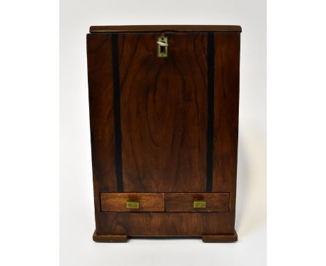 An unusual handmade coin-operated wooden cased cigarette dispenser, the small tabletop lockable cabinet with a burr walnut fi