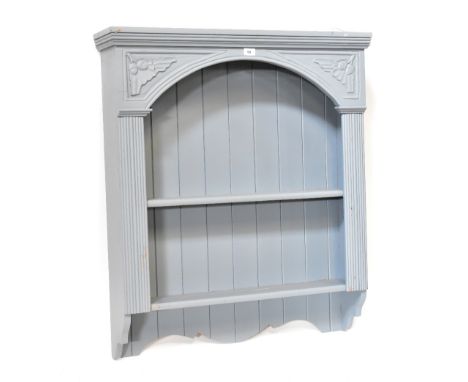 A grey painted wall hanging shelf unit, panelled back and two drawer, carved acorn and oak leaf decoration, 100 x 88 x 19cm.