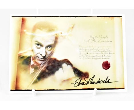 EDWARD HARDCASTLE; a reproduced photograph depicting Sherlock Holmes playing the violin and bearing the actor's signature.We 