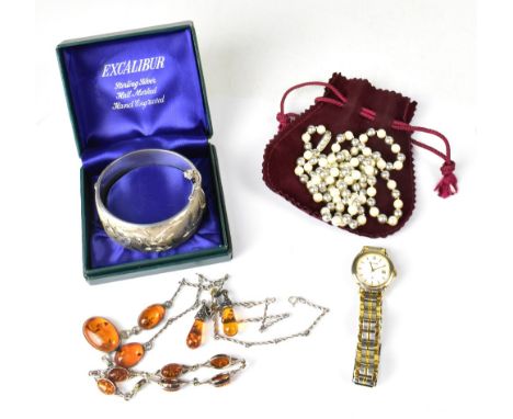 Various items of costume jewellery, to include a hallmarked silver wide bangle with bright cut floral decoration to the front