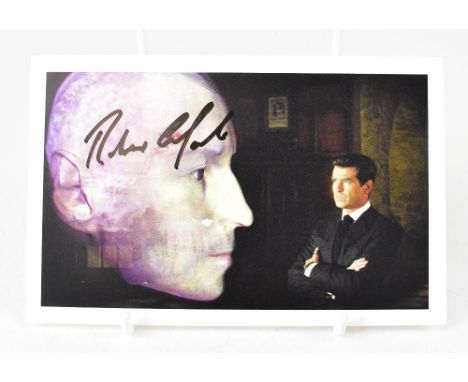 ROBERT CARLISLE; a James Bond promotional postcard bearing the actor's signature.We have not authenticated this signature, pl