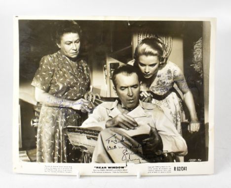 JAMES STEWART; a black and white promotional photograph for the film, 'Rear Window', bearing the signatures of James Stewart,