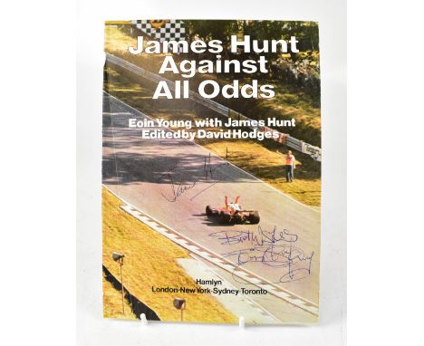 JAMES HUNT; a torn book page from 'James Hunt: Against All Odds', bearing his signature along with another.We have not authen