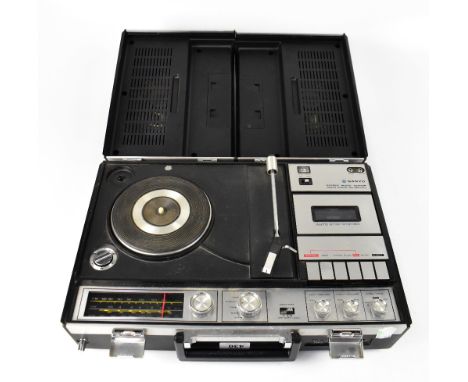 A Sanyo stereo music centre, Solid State portable record and cassette player, lid comprising two removable speakers, all with