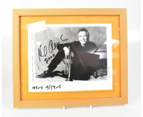 POP ETC; a group of eight autographed stock photographs to include Herb Alpert (The Tijuana Brass), Lionel Richie, Tony Benne