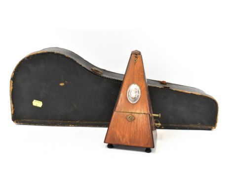 A vintage cased banjo ukulele with wooden body and eight strings, length 54cm, in travel case, together with a vintage German
