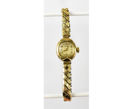 ROTARY; a ladies' vintage 9ct gold watch, the square silvered dial set with Arabic numerals, on a gold plated flexi strap. CO