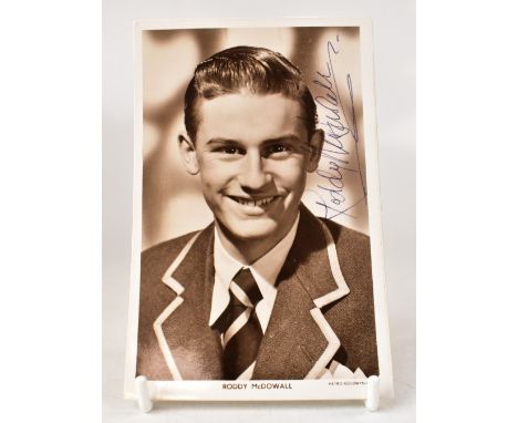 RODDY MCDOWALL; a promotional black and white photo card, bearing his signature, further signed by racing driver James Hunt t