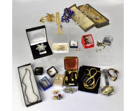 A quantity of costume jewellery to include brooches, necklaces, ear studs, pearls, watches, etc.