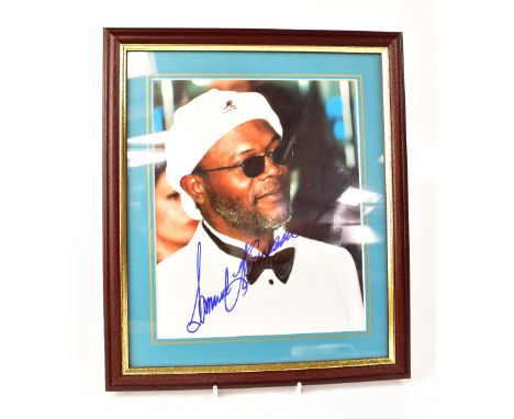 FILM; a group of four autographed promotional pictures comprising Samuel L Jackson, Robert Redford, Hugh Grant and Harrison F