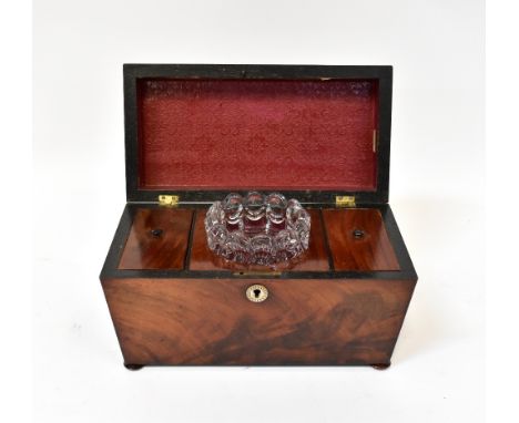 A 19th century mahogany tea caddy of sarcophagus form, with central pressed moulded glass mixing bowl and two compartments wi