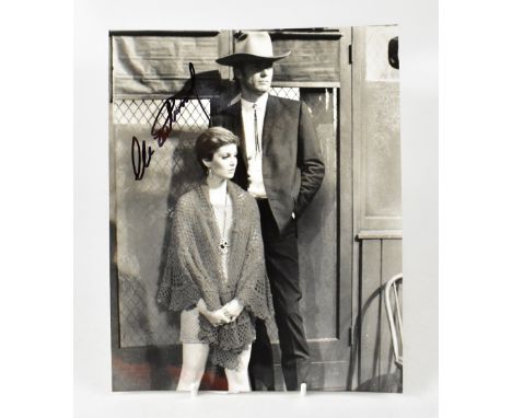 CLINT EASTWOOD; a black and white reproduced photograph of the mega star, bearing his signature, 25.5 x 20.5cm.We have not au