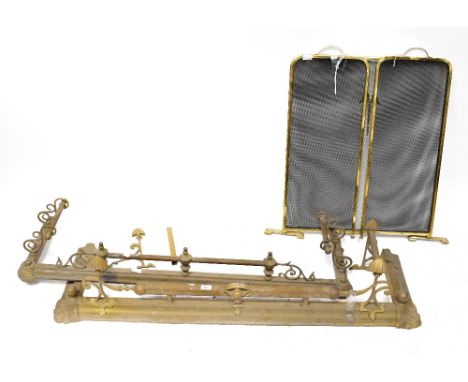 A late Victorian brass fender with Art Nouveau uprights, another similar brass fender with Neo-Classical style urn motifs and