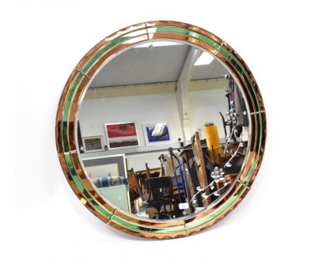 A large circular Art Deco style wall mirror, the clear bevel cut centre circle with reverse cut floral decoration to the side