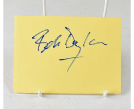 BOB DYLAN; the star's signature on a page from an autograph book.We have not authenticated this signature, please satisfy you