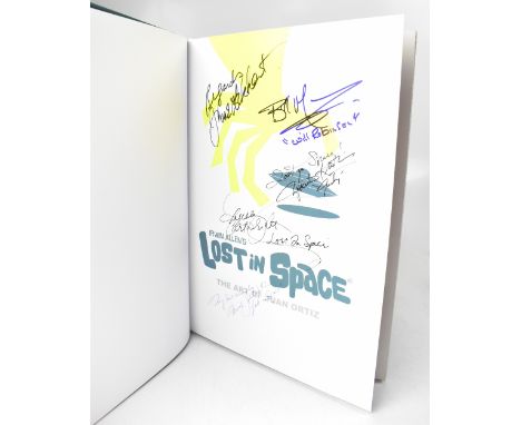 LOST IN SPACE: THE ART OF JUAN ORTIZ; a large volume bearing numerous signatures and a related first day cover (2).We have no