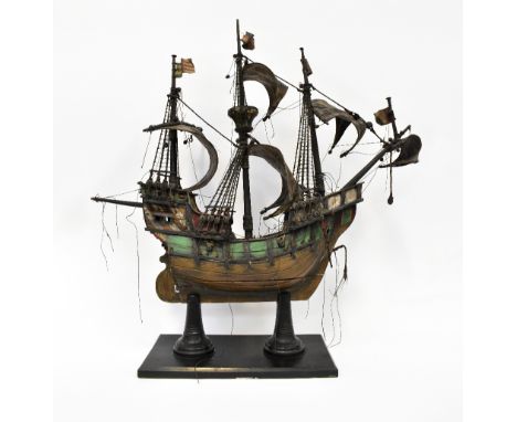 A scale model of Christopher Columbus' ship 'Santa Maria', a three-masted galleon, in full sale with various flags and riggin