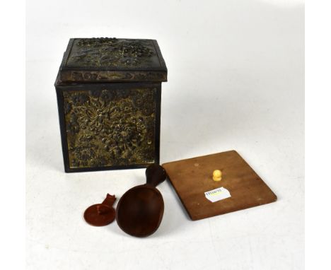 A late 19th /early 20th century Japanese white metal gilt-heightened tea caddy with relief decoration of chrysanthemums, peon