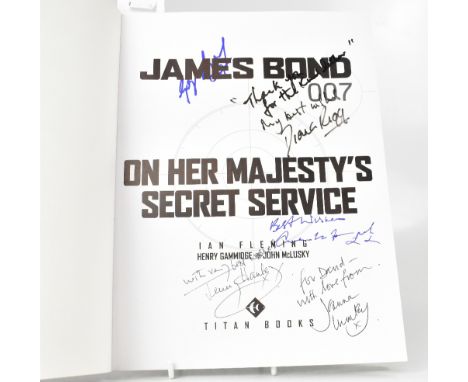 JAMES BOND; 'On Her Majesty's Secret Service', a comic book style book bearing several signatures including George Lazenby, D