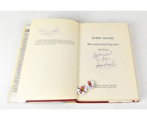 SIR BOBBY MOORE; 'The Authorised Biography', bearing the footballing great's signature, further signed by Terry O'Neill and s