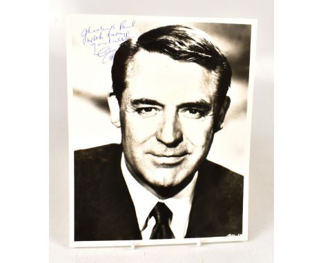CARY GRANT; a black and white photograph of the famous actor, bearing the star's signature, 25 x 20cm.We have not authenticat