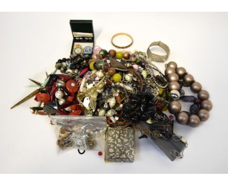 A large quantity of costume jewellery to include bangles, bracelets, necklaces, gilt chains, faux pearl necklaces, pearl brac