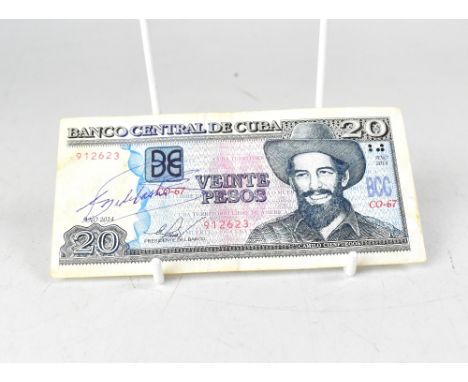 FIDEL CASTRO; four Cuban pesos notes, one bearing the signature of Fidel Castro, also a Cuban stamp (5).We have not authentic