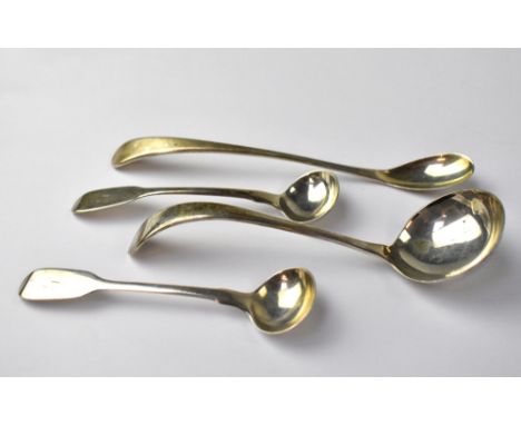 Four pieces of hallmarked silver cutlery, comprising two similar mid-Victorian Edinburgh silver mustard spoons, a small Sheff
