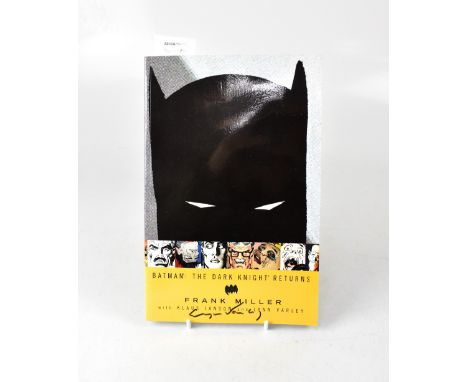 BATMAN; 'The Dark Knight Returns', a comic book volume, signed to the exterior by Lynn Varley and to the interior by Klaus Ja