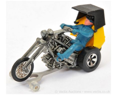 Hot Wheels (Mattel) Rrrumblers Revolution - yellow and black plastics with blue figure rider, black hat, with guide - overall